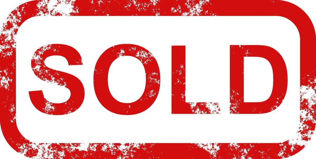 SOLD sign in red