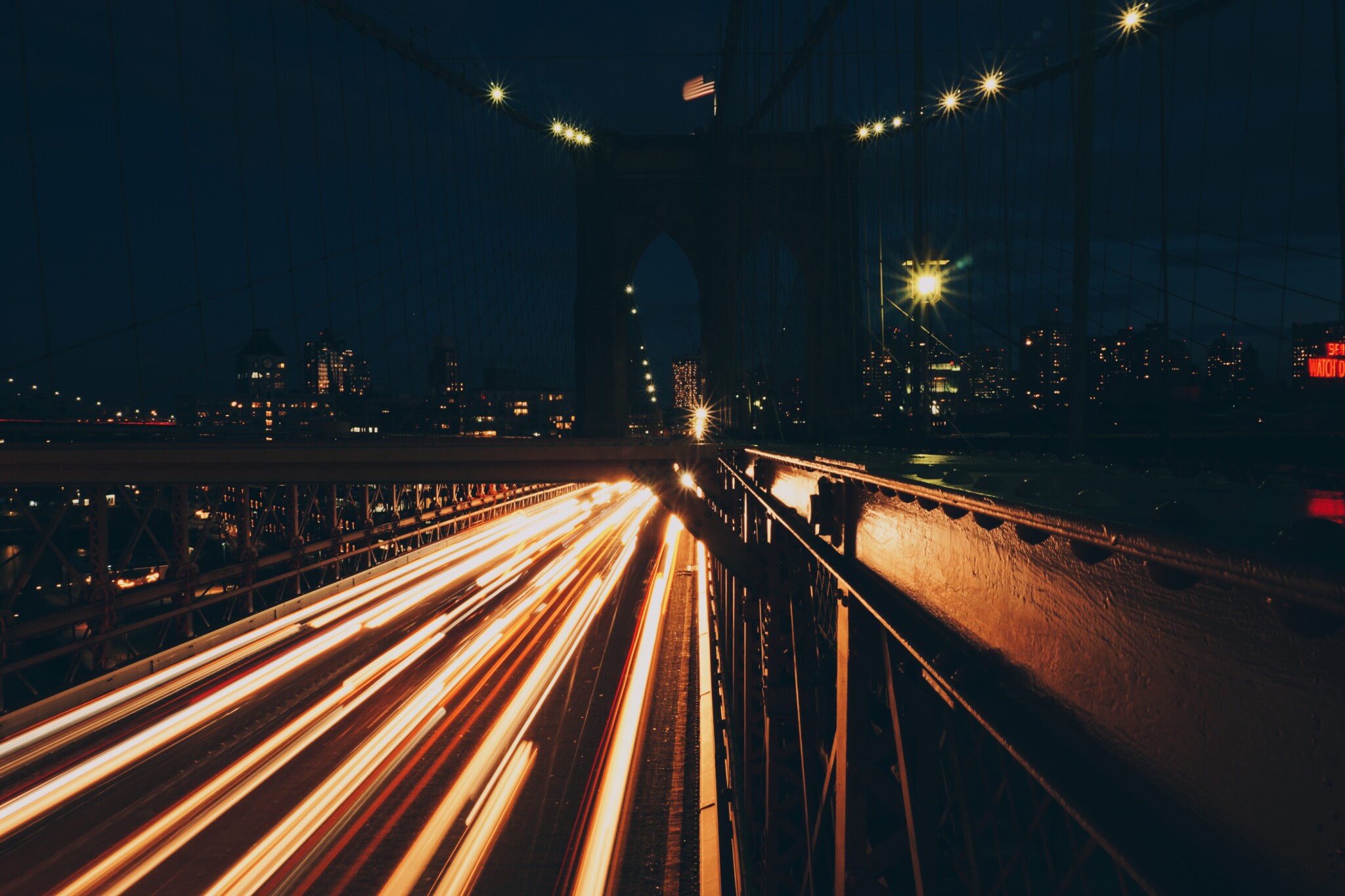 traffic in motion at night from a bridge