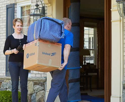 Mover bringing items into a home