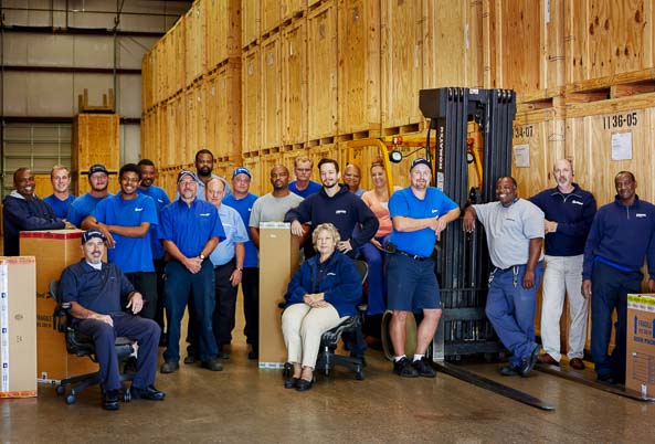 Hilldrup team in a warehouse