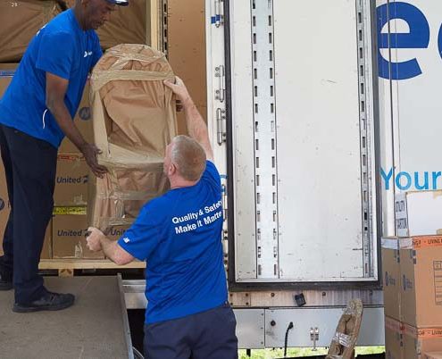 Movers packing a truck