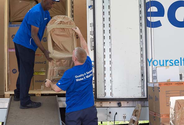 Movers packing a truck