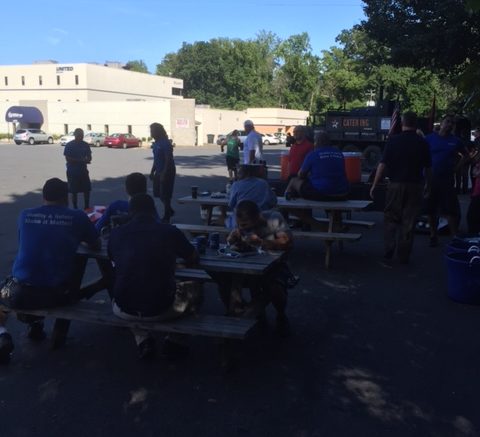 Employees enjoy lunch outside