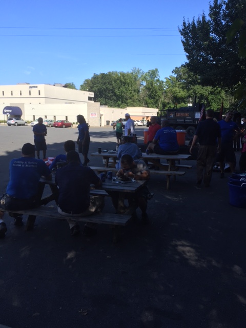 Employees enjoy lunch outside