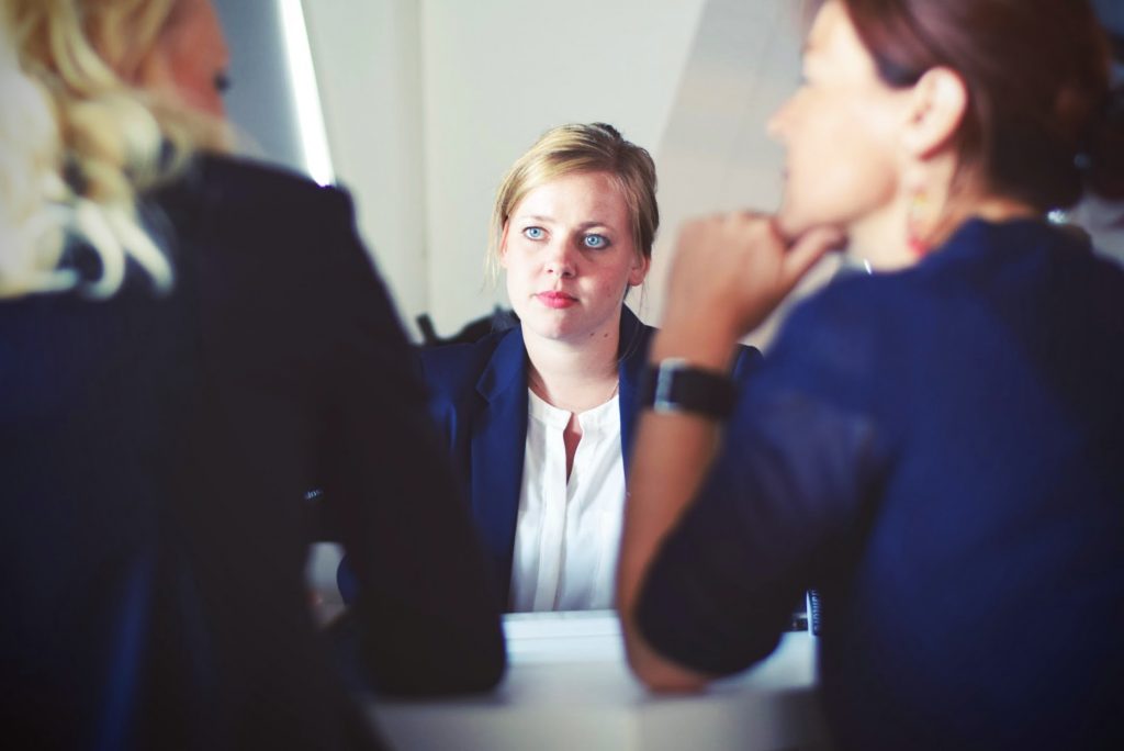Employee listening to her managers
