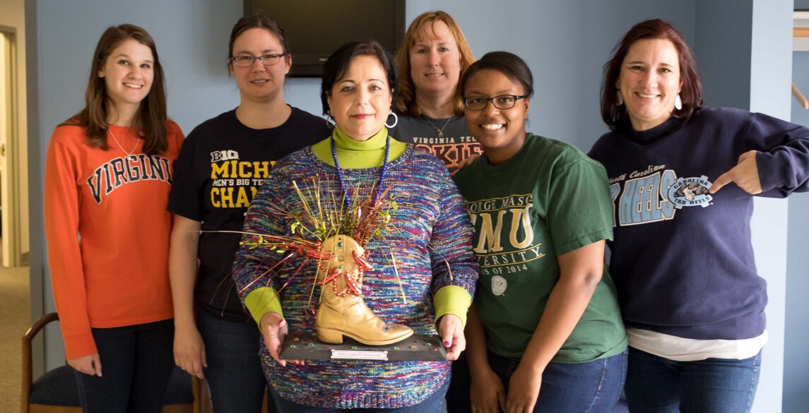 Chilo Cook off participants with trophy