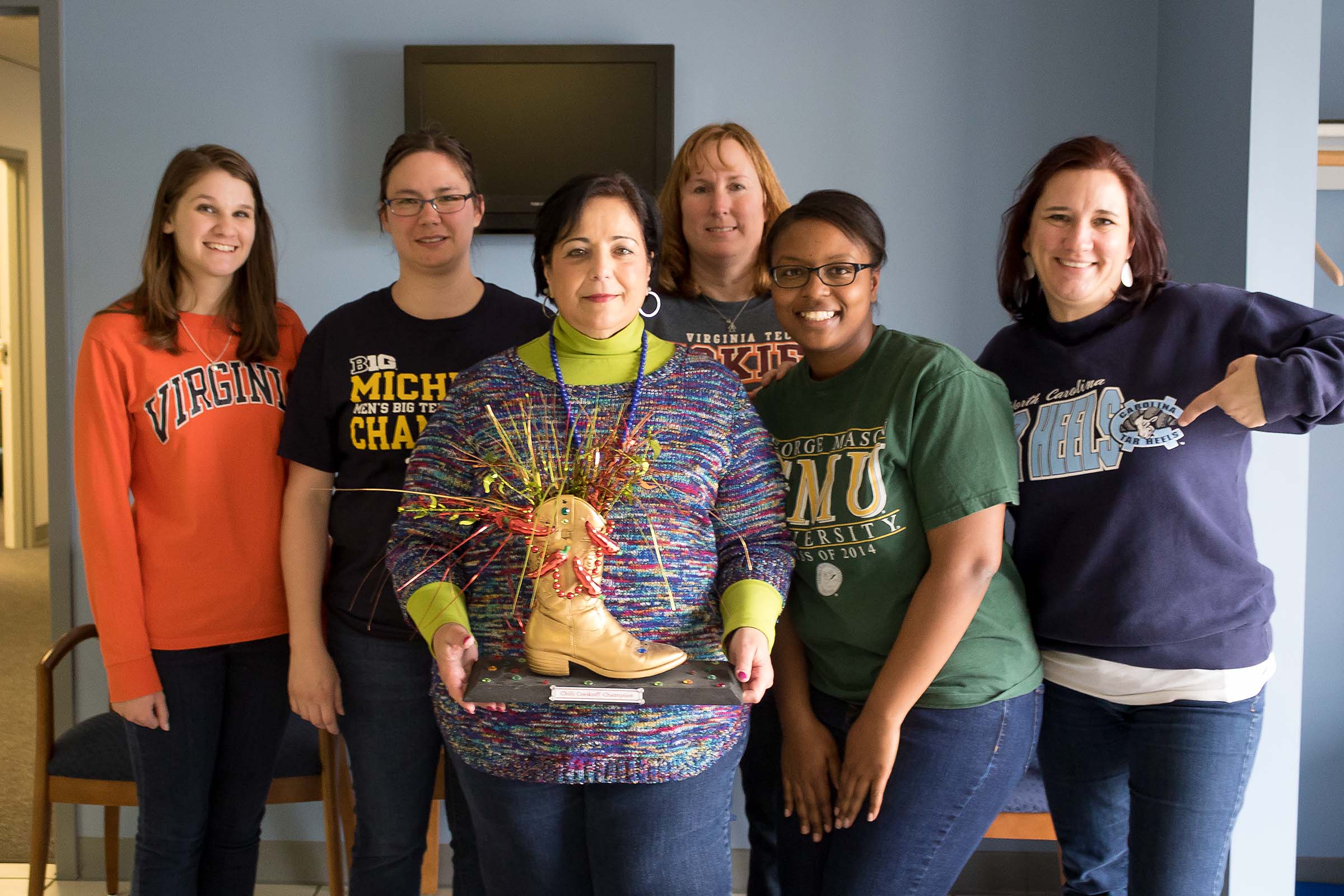 Chilo Cook off participants with trophy