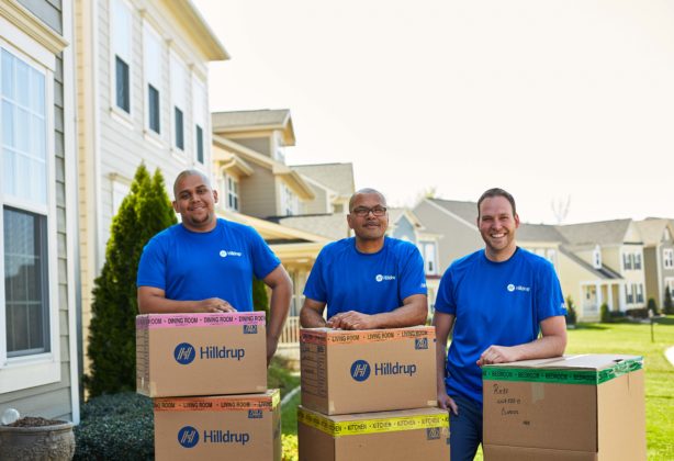 Hilldrup packers outside of home with boxes