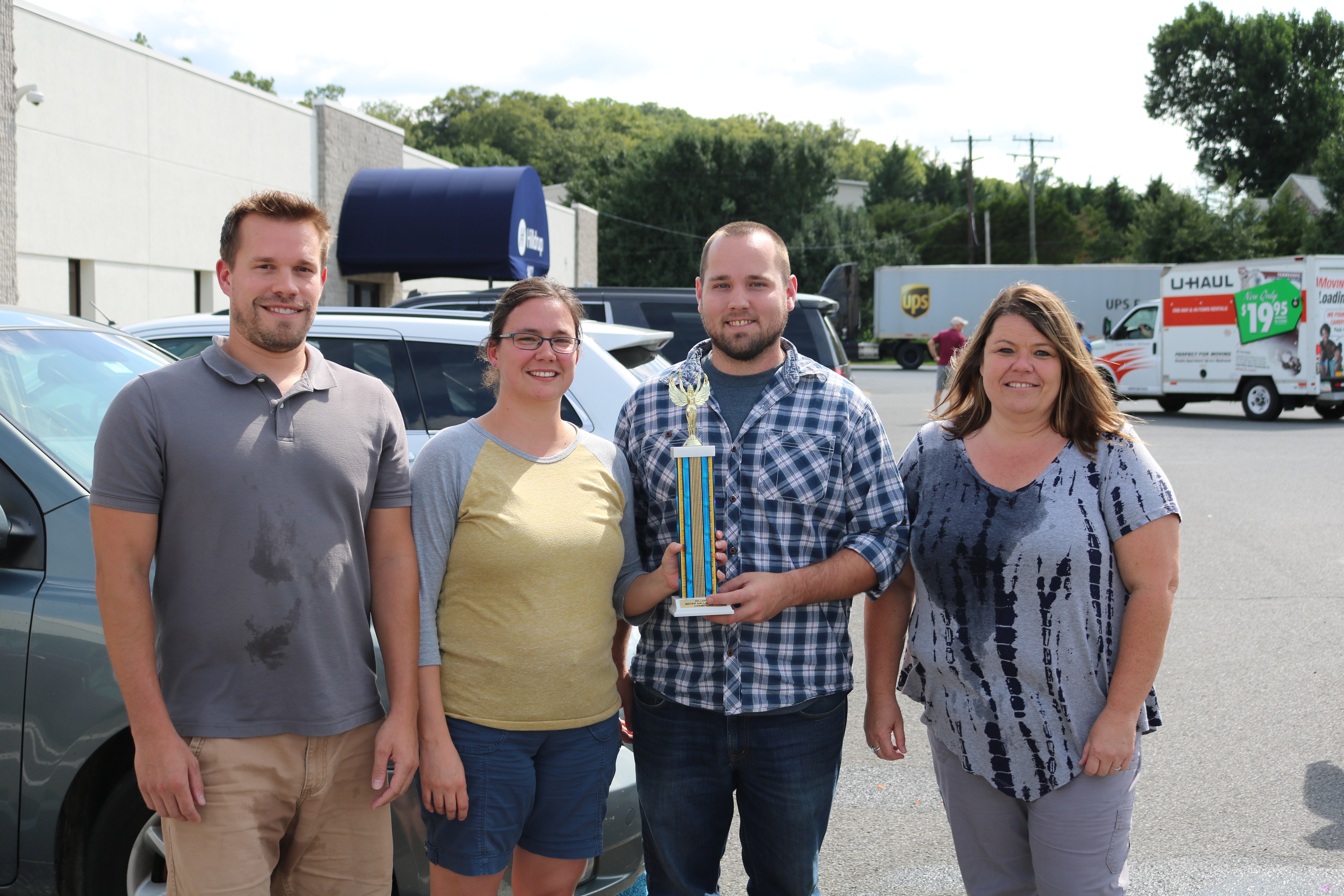 Employees line up to participate in water balloon toss