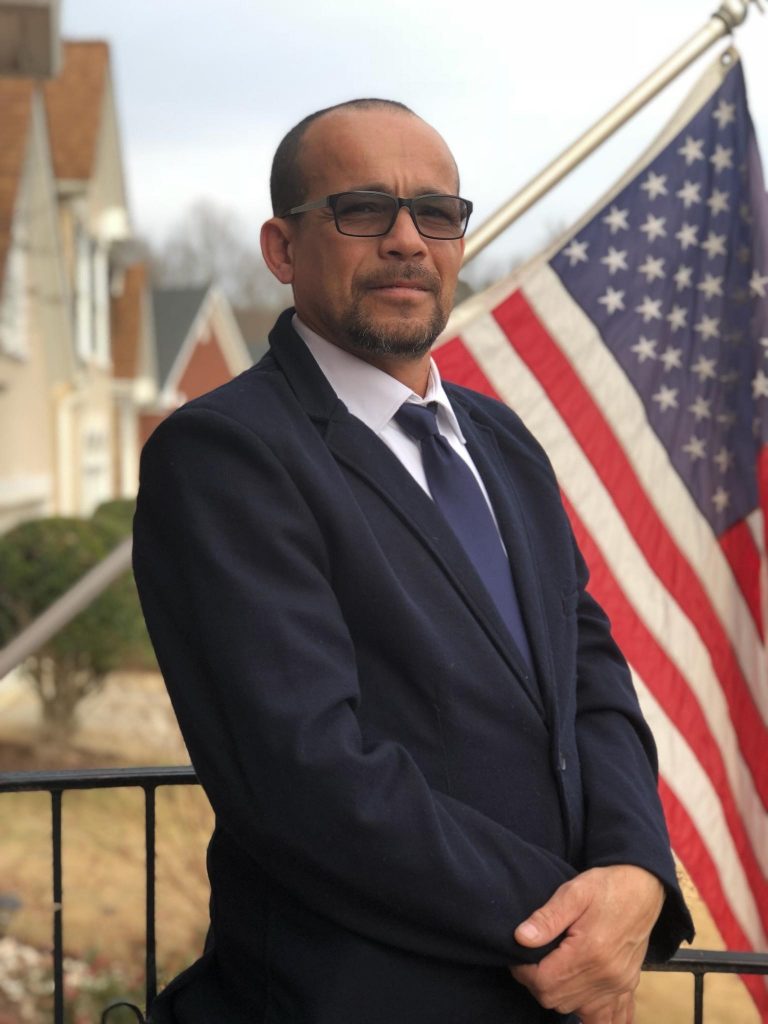 Eric Galioto, Van Operator for Hilldrup, standing on balcony.