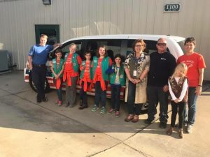 Hilldrup employees with girl scouts at candy drive