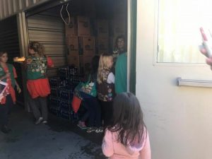 Girl scouts assisting with candy drive