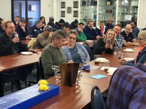 Carlton opens gifts during retirement celebration