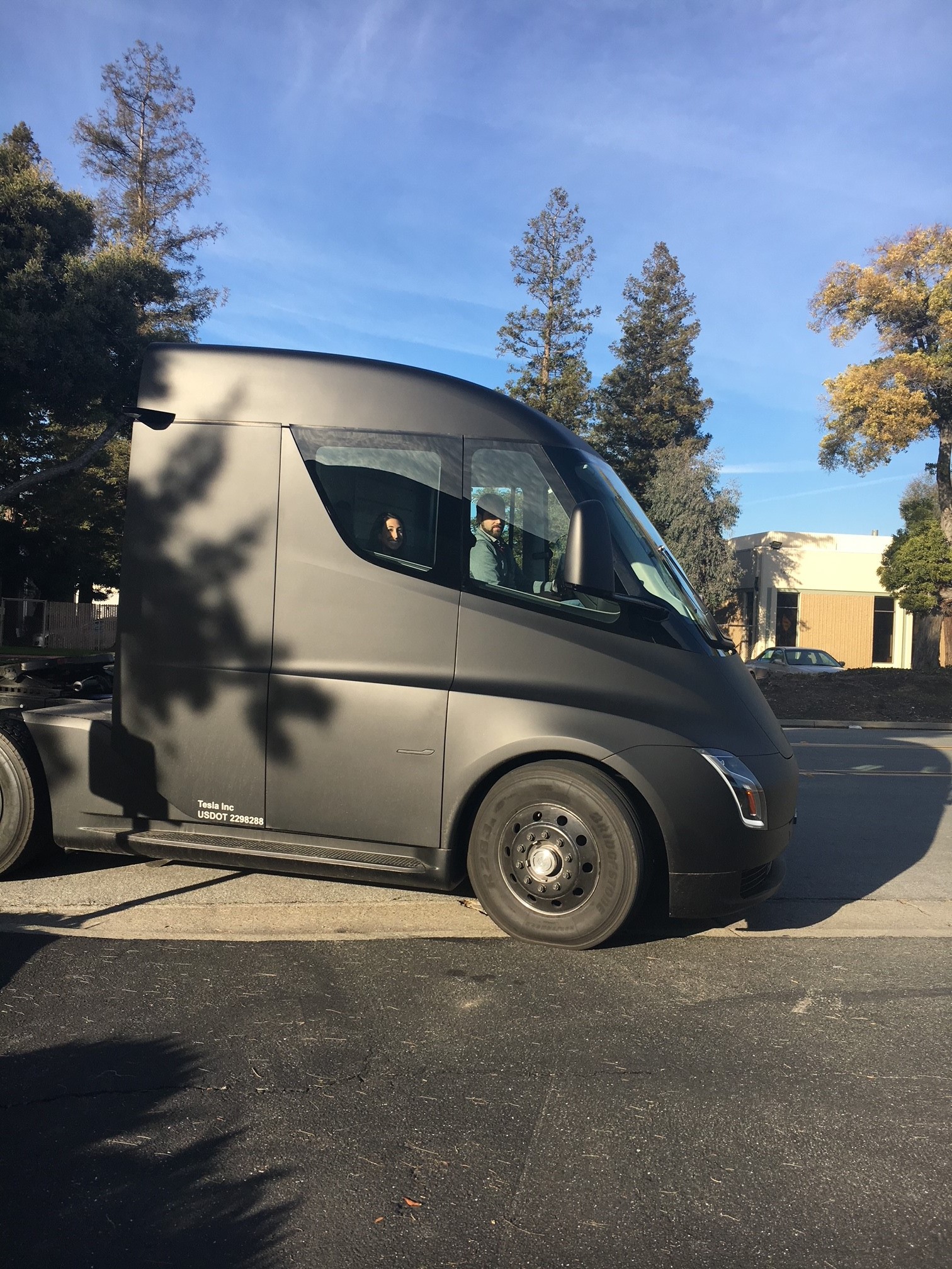 Visitors next to the Tesla Semi