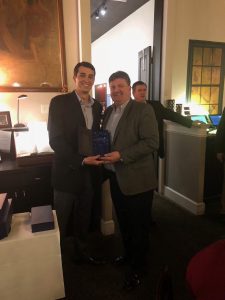 Rick Barnett accepts sales award from Charlie McDaniel