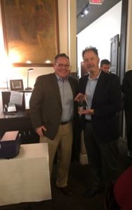Sales Award presented to employee from John Lohmeyer