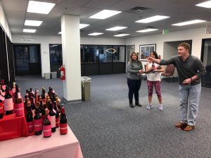 Employees play for a chance to win a wine