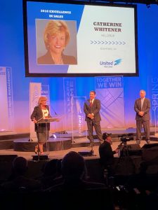 Cathy Whitener speaking at podium at award's ceremony
