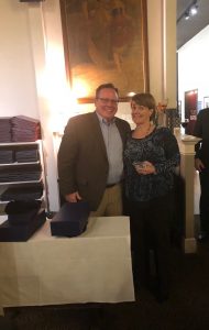 Mary Katherine accepts sales award from John Lohmeyer