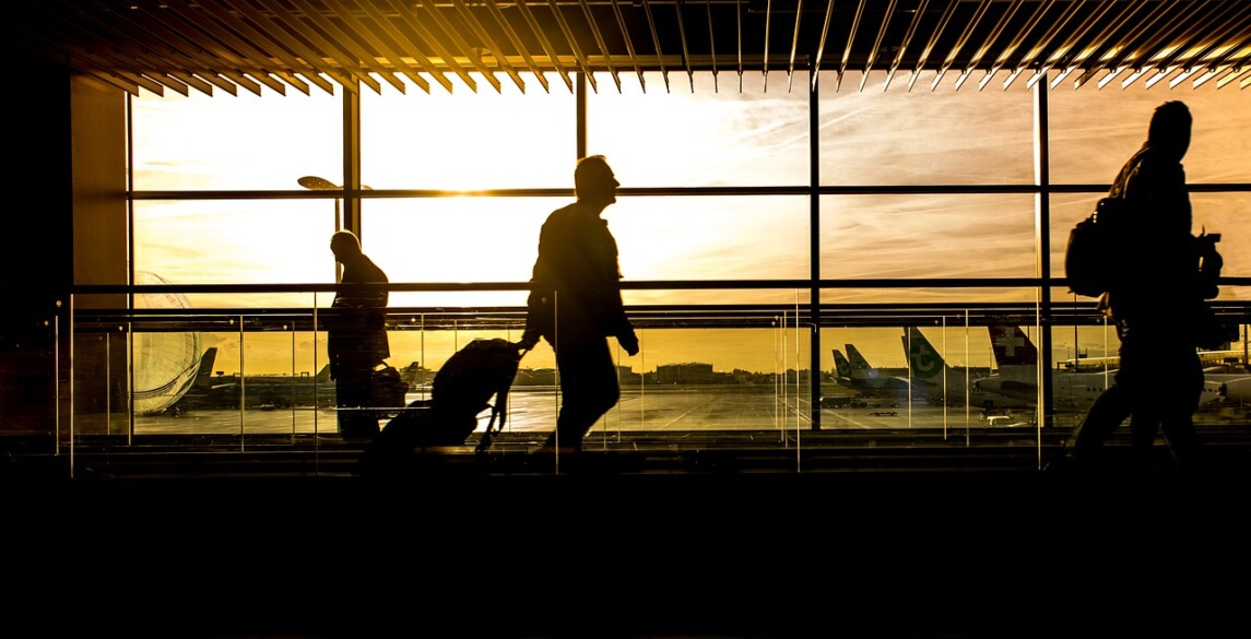 People walking through an airport