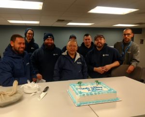 Estaban's retirement party with colleagues and cake