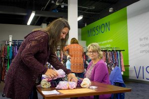 Hilldrup employee shops for leggings at LuLaRoe table