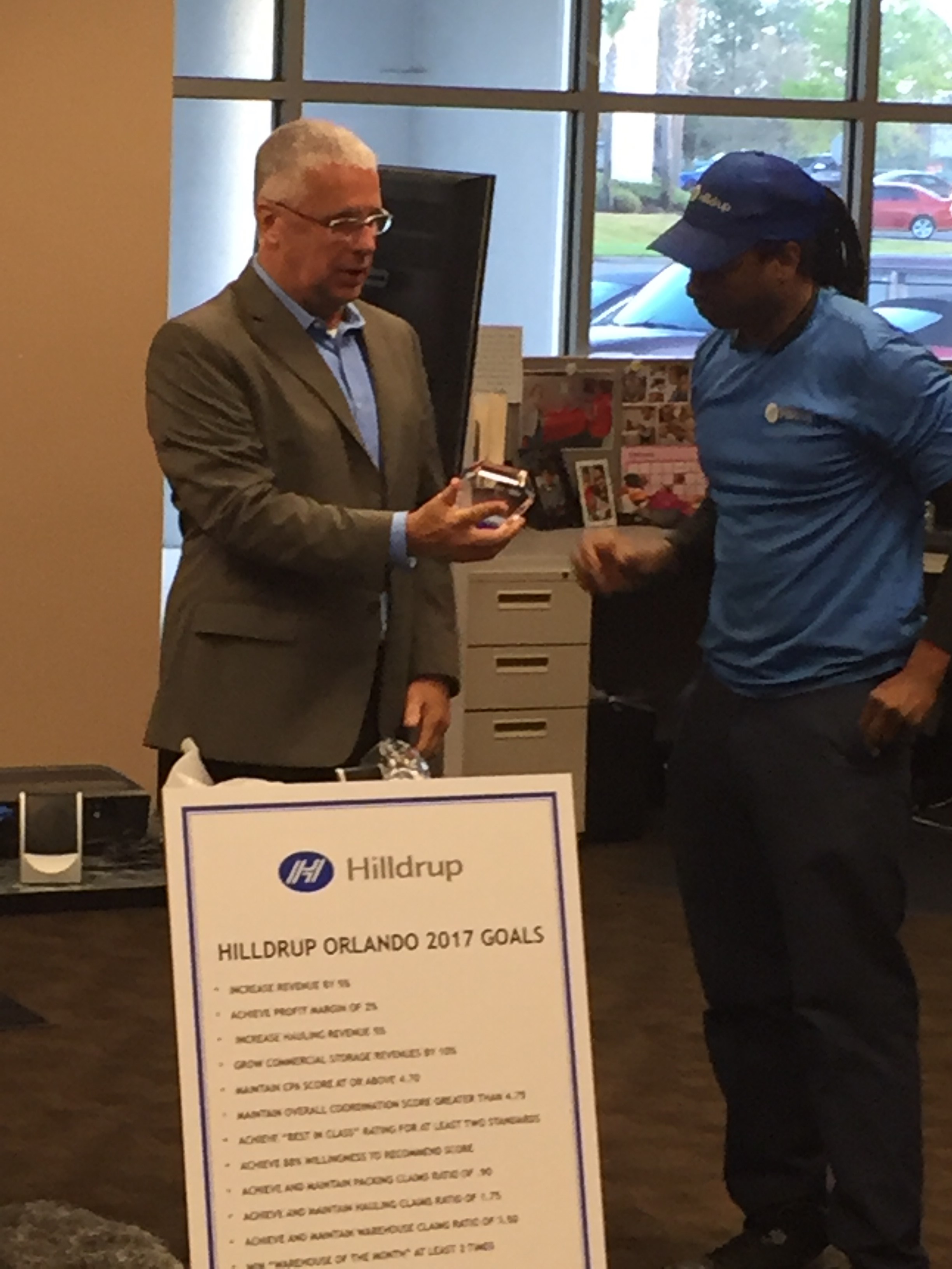 Hilldrup Orlando presenting awards to employees