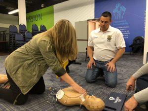 Hilldrup employee learns CPR on dummy