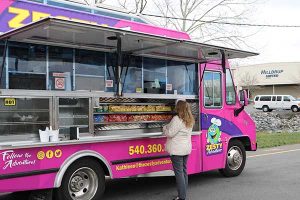 Woman orders from food truck