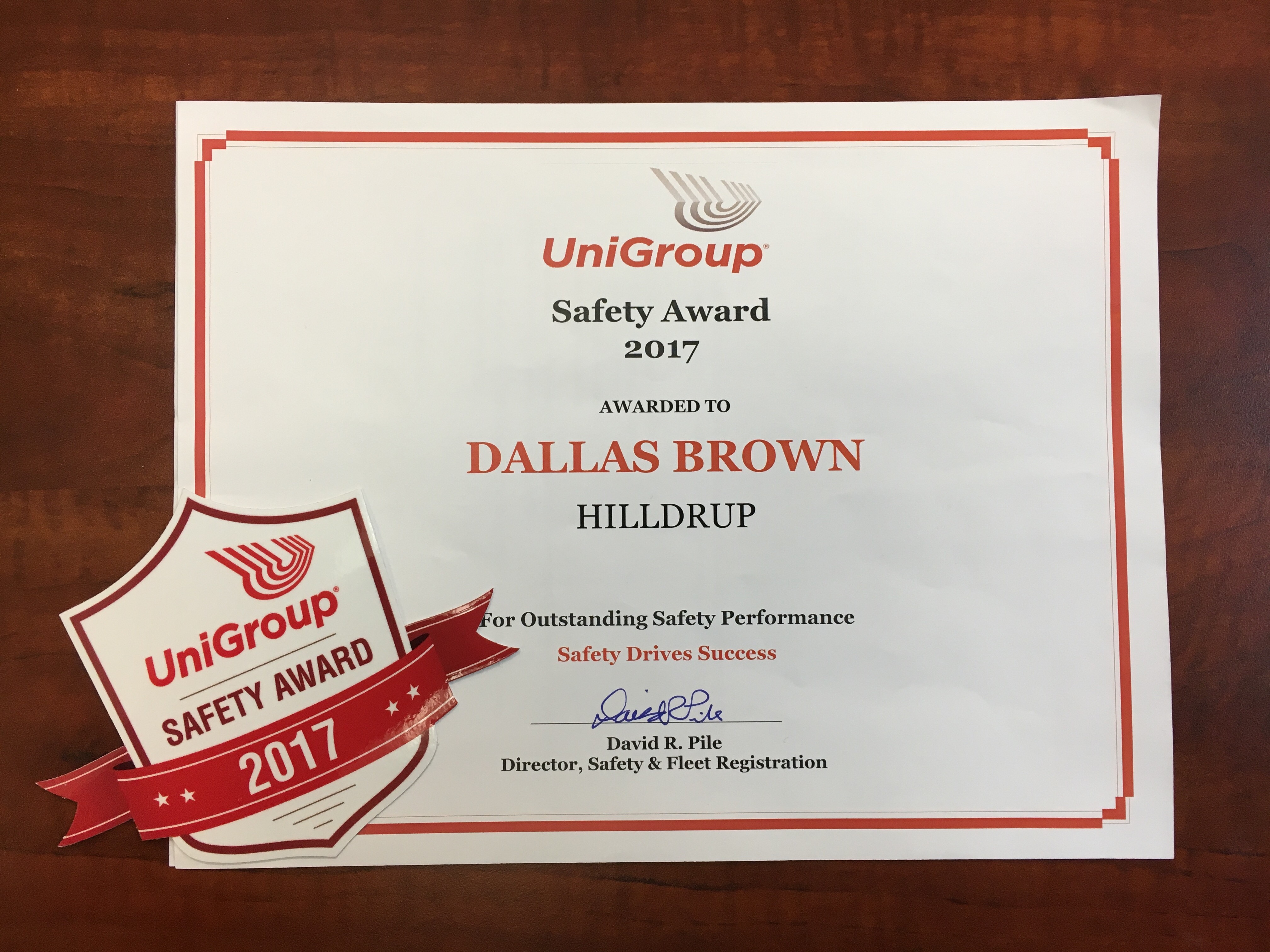 Dallas Brown with award from UniGroup