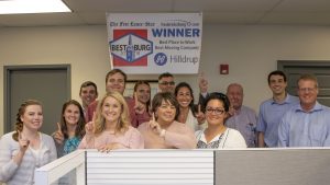 Hilldrup team photographed with 2018 Best in the Burg banner
