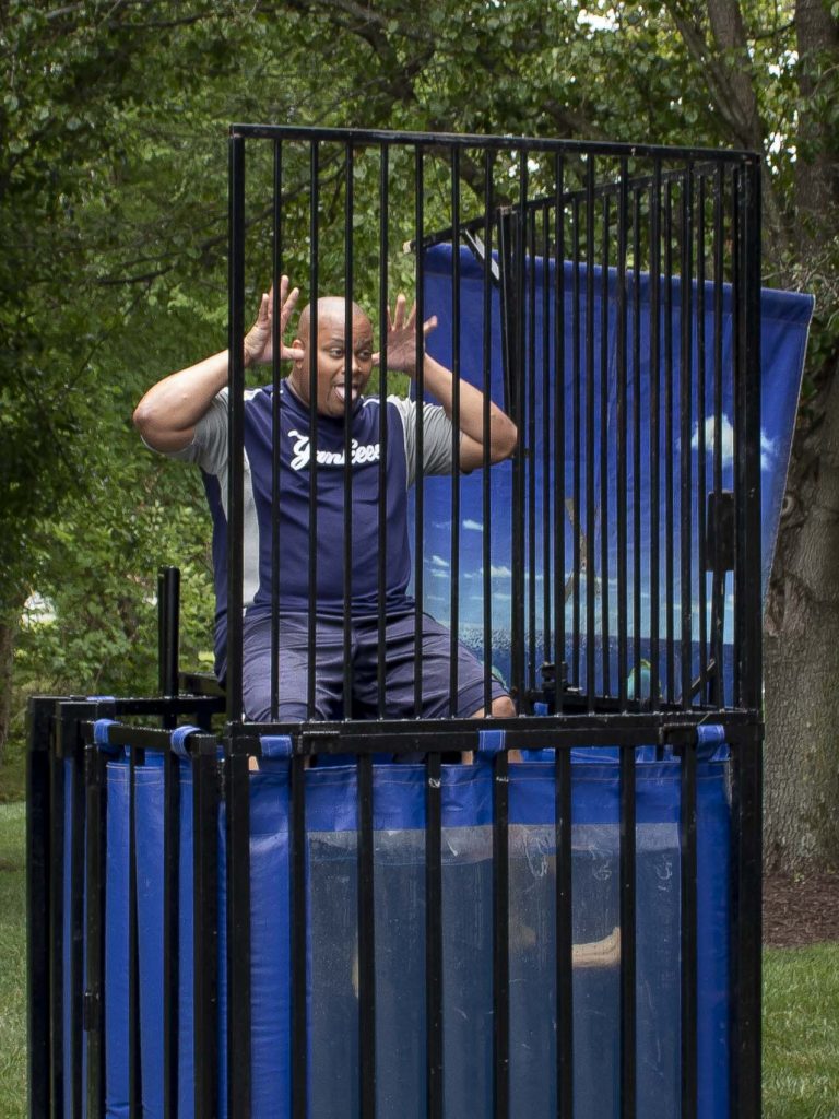 Caesar Lovett making silly faces in the dunk tank at players