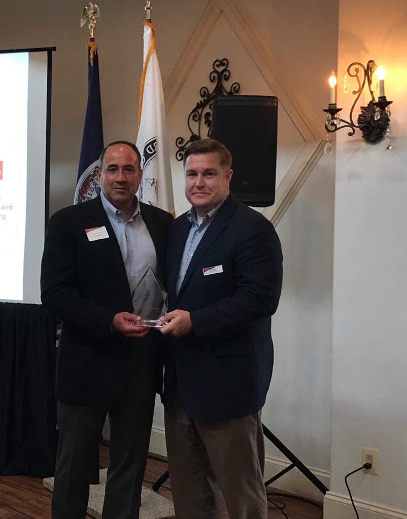 Charles W McDaniel recognizing Joel Griffin with the 2018 Stafford Cornerstone award
