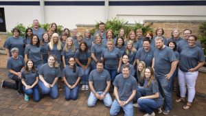 Group photo of Stafford employees at Stafford location for spirit day
