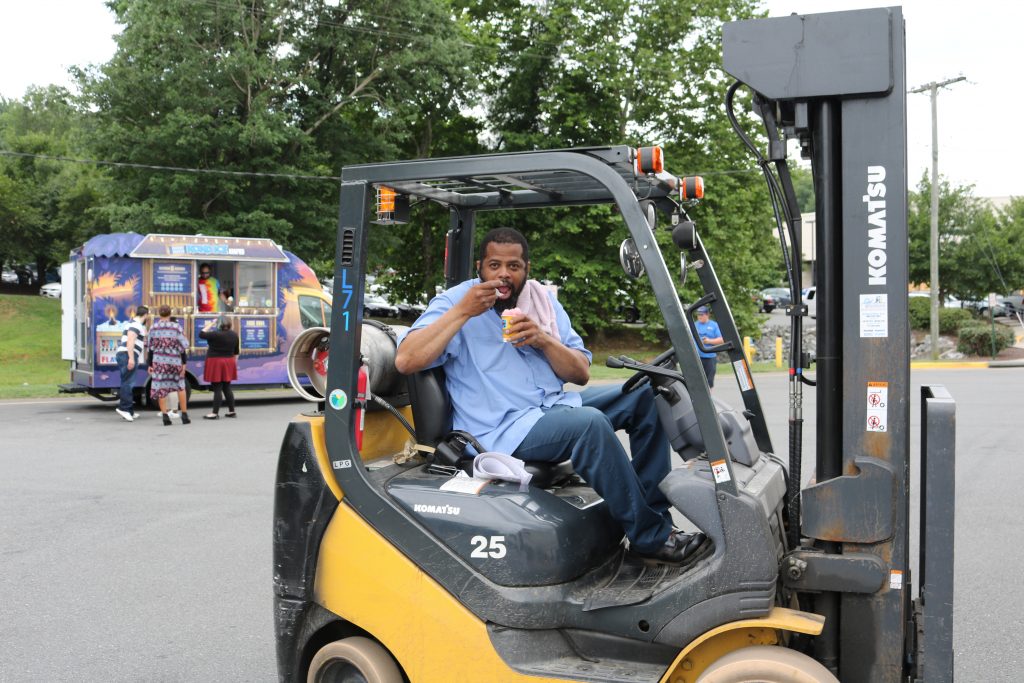 Russell Hall enjoying some Kona Ice during a break from working the forklift