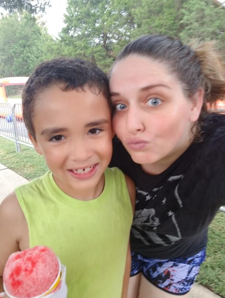 Son and mom enjoy the summer heat outdoors