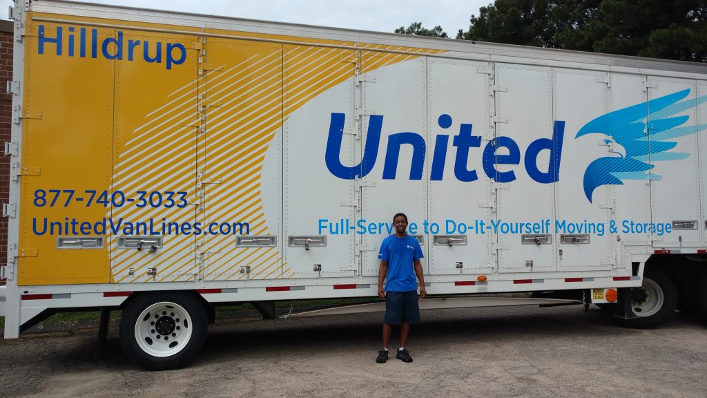 Hilldrup employee in front of truck