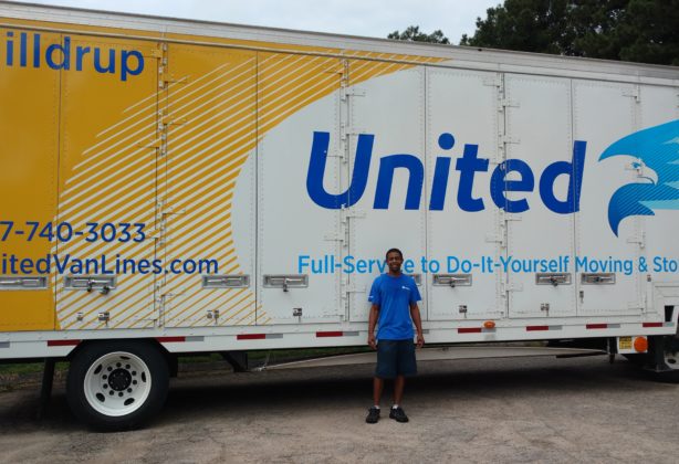 Hilldrup employee in front of truck