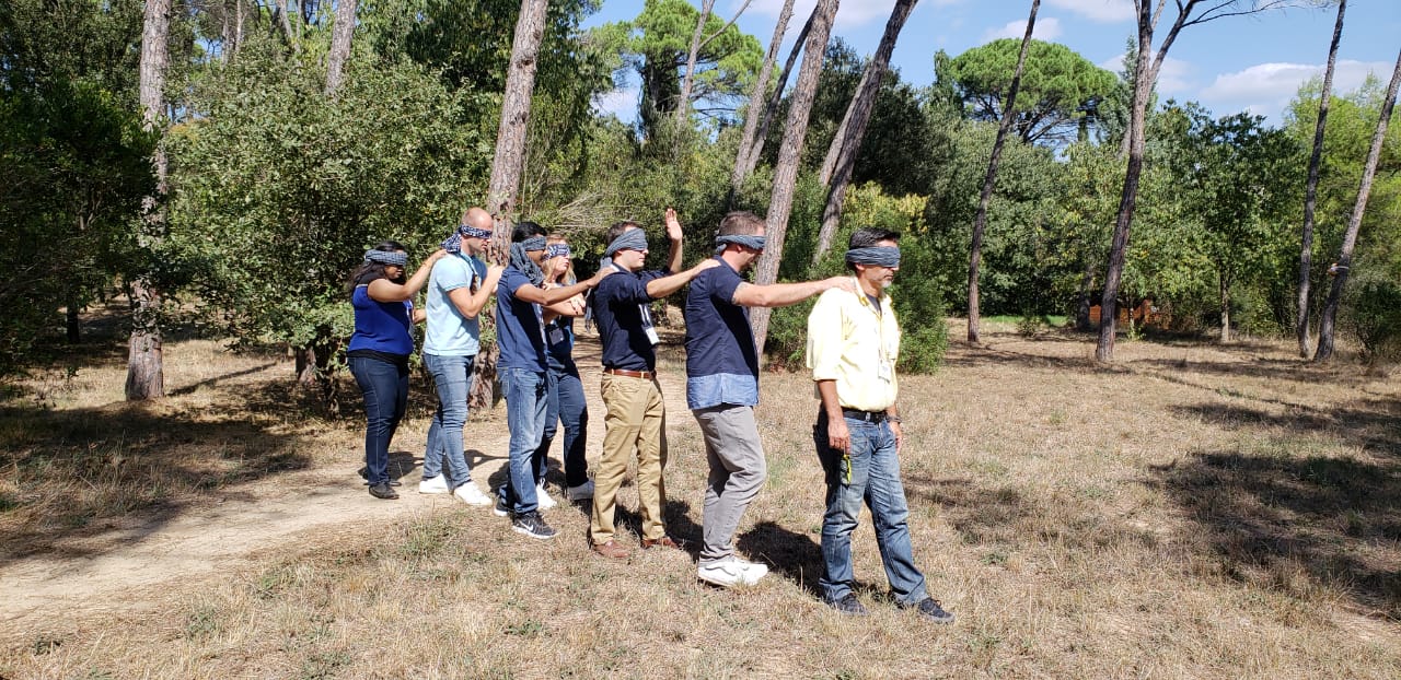 FIDI students participate in a group activity with blindfolds.