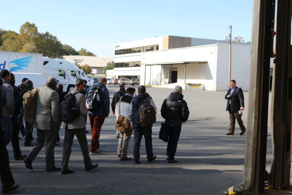 John Walick leads a tour group outside