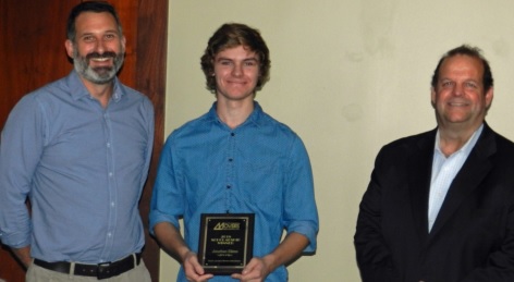 Scholarship award winner with two presenters