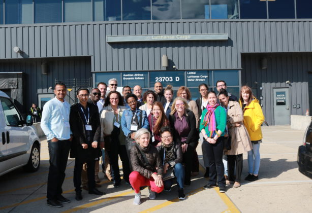 FIDI EiM students gather for a photo outside of airport