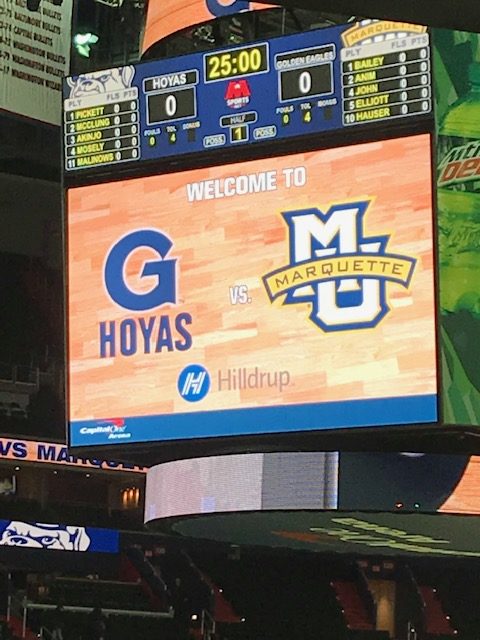 Hilldrup team members at center court at Georgetown Basketball game