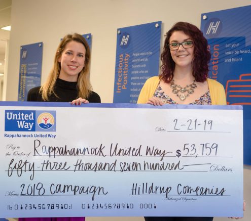 Charles W McDaniel and Hilldrup leaders posing with check of $53,000 for Rappahannock United Way