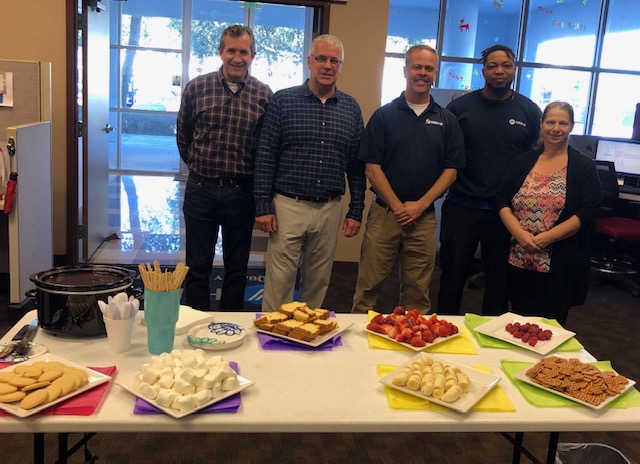 Hilldrup Orlando team with sweets on a table