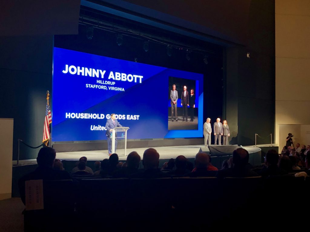 Johnny Abbott being presented with award at UniGroup's 2019 Learning Conference