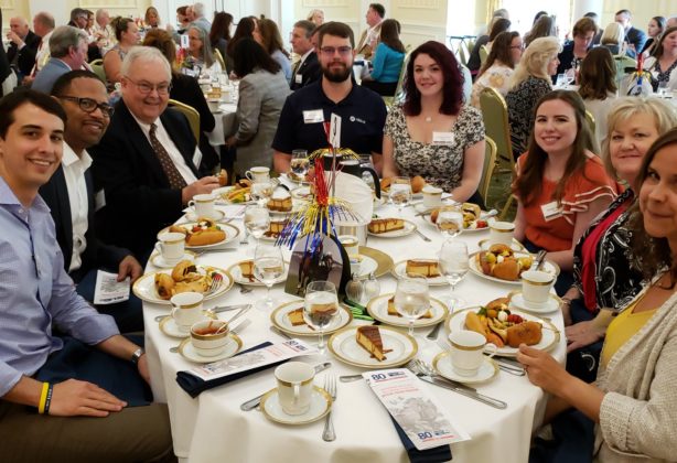 Charlie McDaniel and other Hilldrup employees enjoying a meal at the 2018 campaign celebration