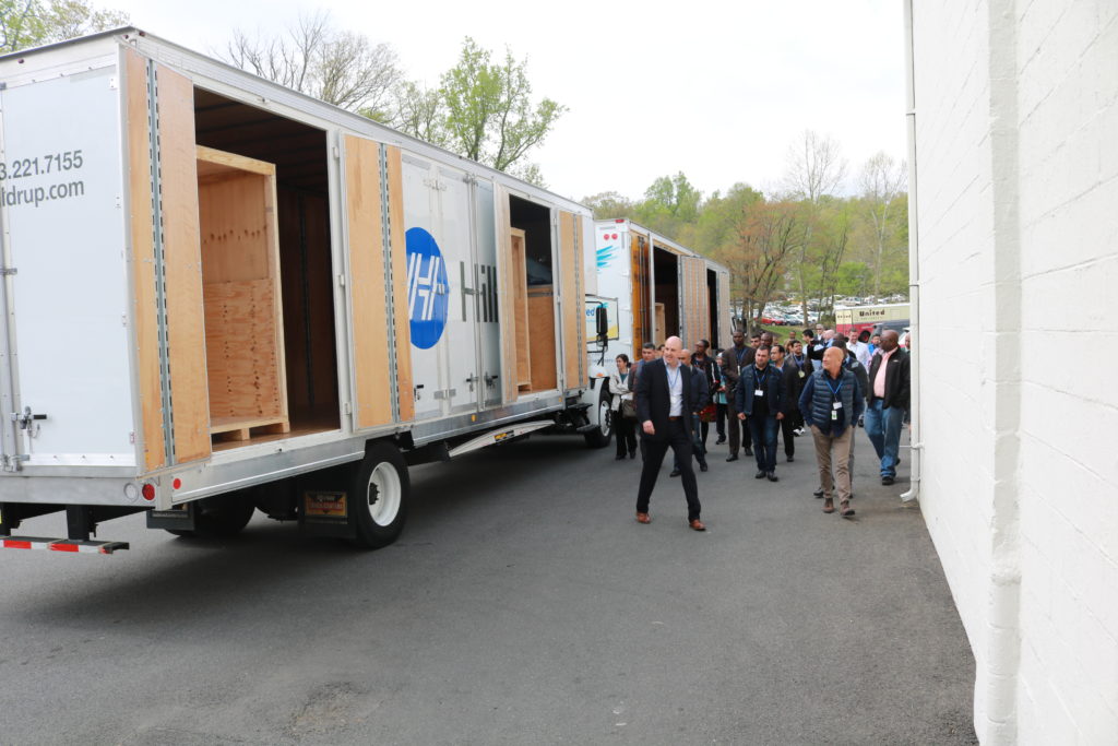 Stafford's employees showing the Department of State’s transportation division the inside of moving trucks