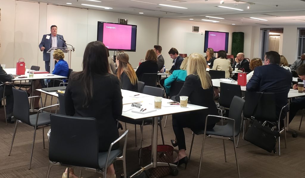 Employees listening to Doug Barnett speak