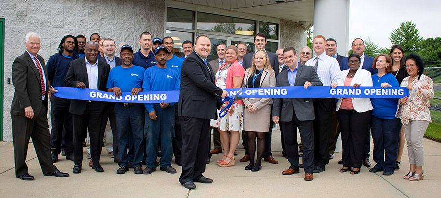 Matt Dodson cutting grand opening ribbon at the Capitol Heights location in Maryland